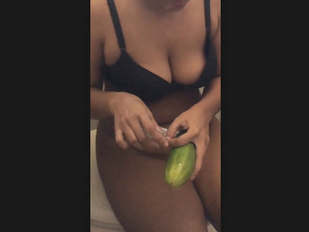 Desi girl takes cucumber in her tight pussy